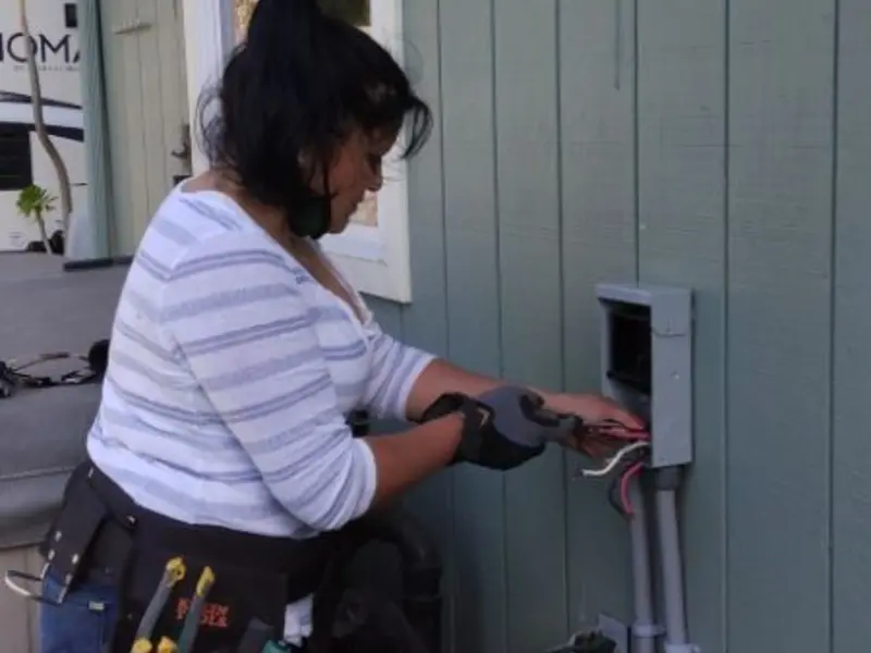 Licensed electrician wiring an exterior subpanel in Childress
