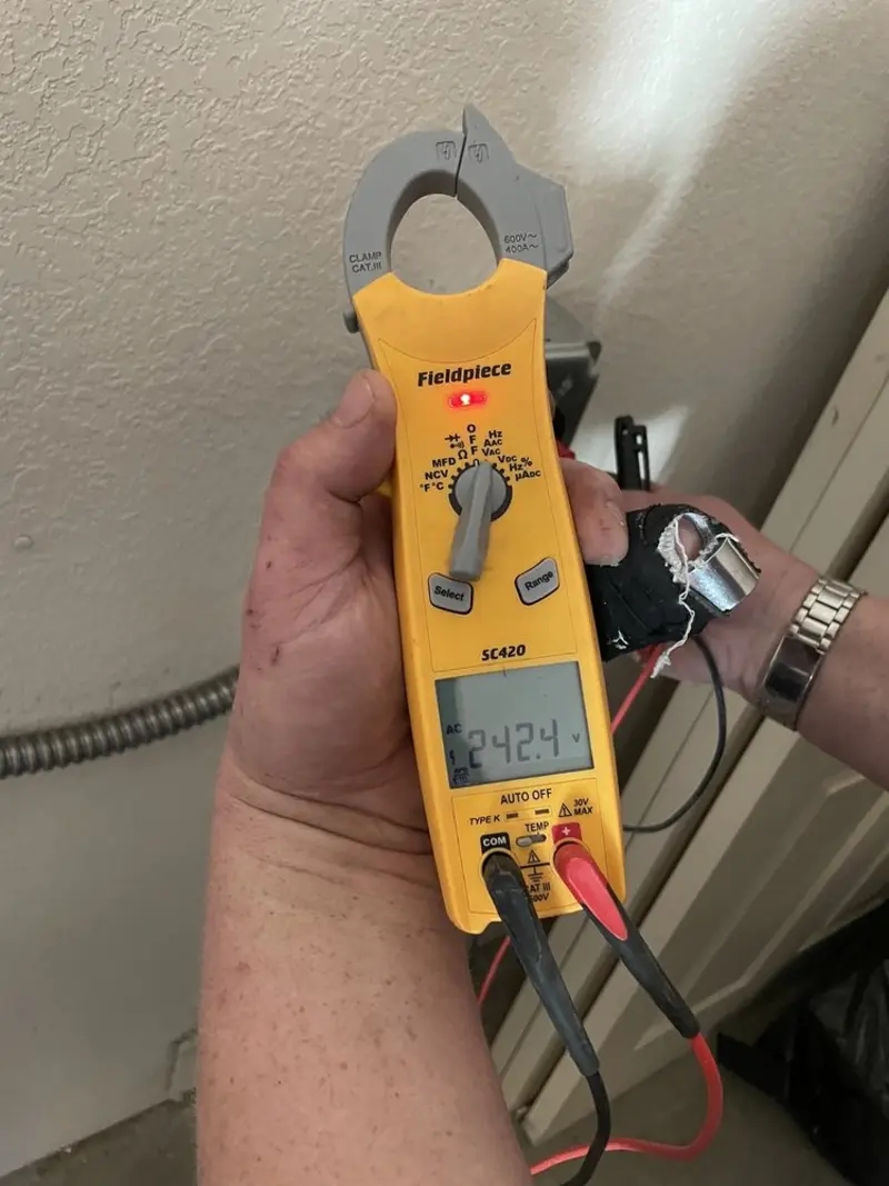 Voltage testing with clamp meter during Outlet Installation in Childress